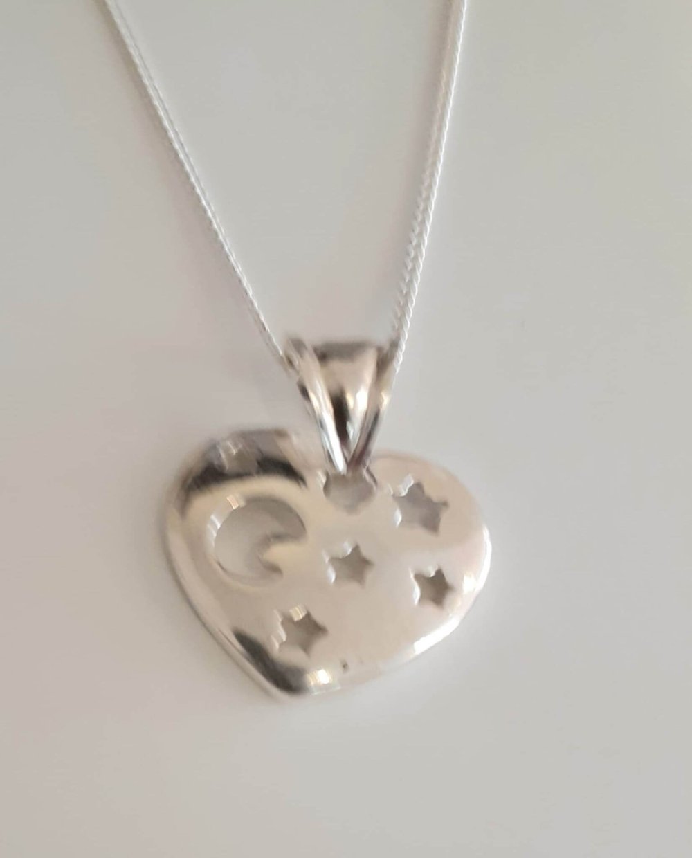Heart Pendant with moon & stars on a silver necklace