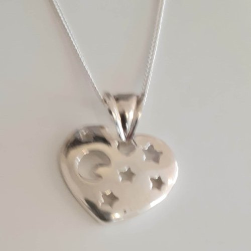 Heart Pendant with moon & stars on a silver necklace