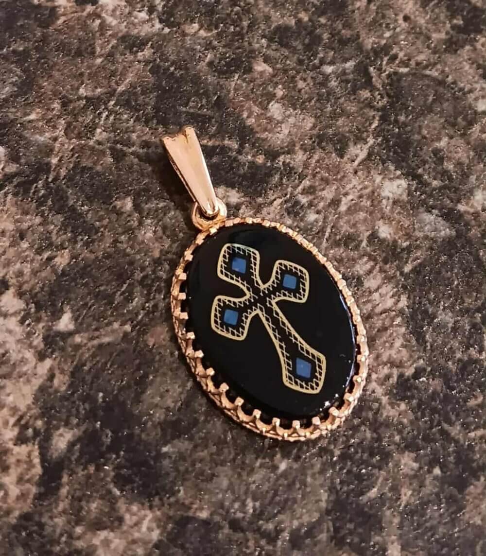 Black Onyx with a Cross Etched on it