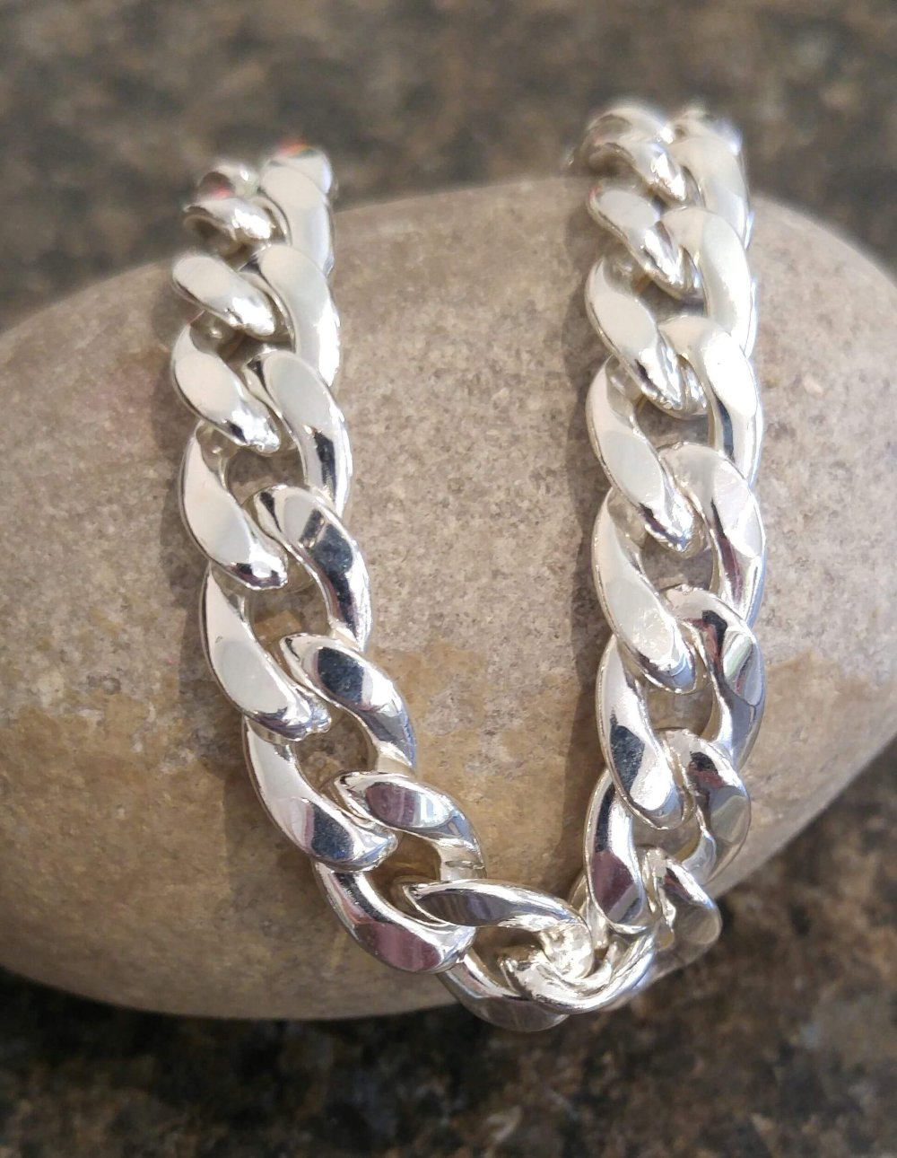 Cuban link styled silver bracelet.